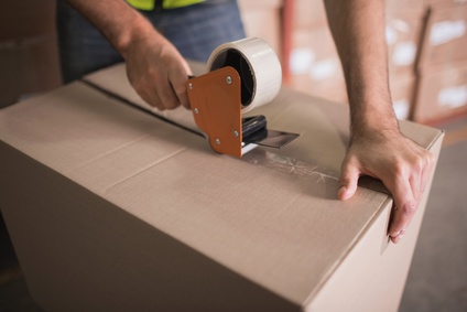 Worker preparing goods for dispatch